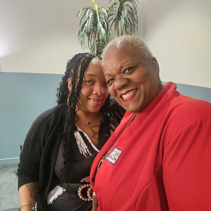 Two club members smiling together